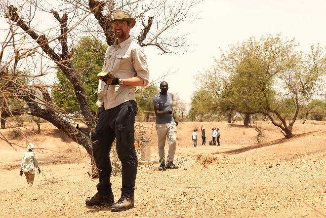 Colin Miazga, the technical lead on this project, guiding the cable layout in a wadi at the Metche Refugee Camp.